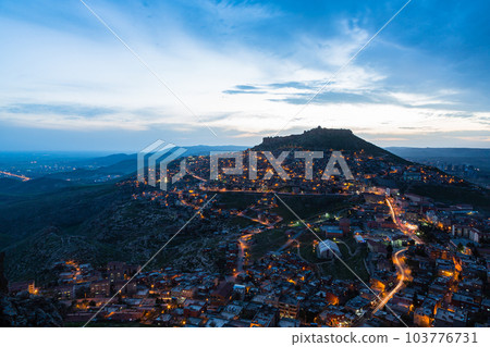 Turkey Night view of the illuminated old town of Mardin and Mardin Castle on the top of the mountain Turkey Night view of the illuminated old town of Mardin and Mardin Castle on the top of the mountain 103776731