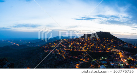 Turkey Night view of the illuminated old town of Mardin and Mardin Castle on the top of the mountain Turkey Night view of the illuminated old town of Mardin and Mardin Castle on the top of the mountain 103776736