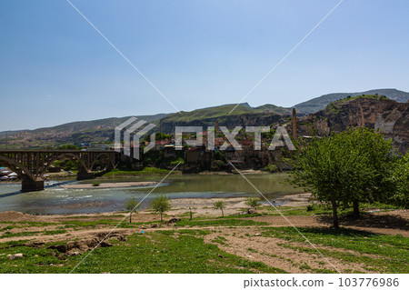 El Rudzuq Camii in Hasankeyf, Turkey and the Hasankeyf Bridge over the Tigris River 103776986