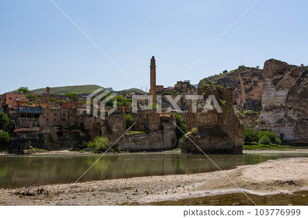 El Rudzuq Camii in Hasankeyf, Turkey and the Hasankeyf Bridge over the Tigris River El Rudzuq Camii in Hasankeyf, Turkey and the Hasankeyf Bridge over the Tigris River 103776999