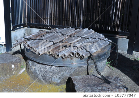 A well left in a corner of town A well left in a corner of town 103777047