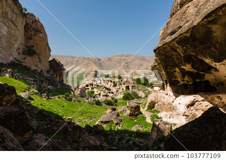 Hasankeyf Castle in Hasankeyf before submersion in Turkey and a valley with cave dwellings 103777109