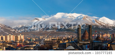 The cityscape, Chifte Minare and Palandken Mountain seen from Erzurum Castle in Erzurum, Turkey 103777285