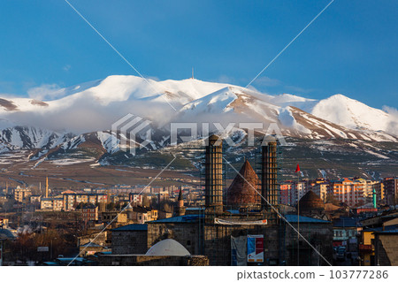 The cityscape, Chifte Minare and Palandken Mountain seen from Erzurum Castle in Erzurum, Turkey The cityscape, Chifte Minare and Palandken Mountain seen from Erzurum Castle in Erzurum, Turkey 103777286