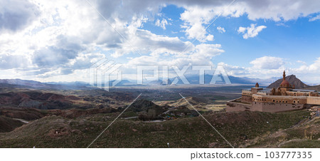 Turkey Isaac Pasha's Palace on the hillside and the city of Dogubeyazit and the mountains beyond 103777335