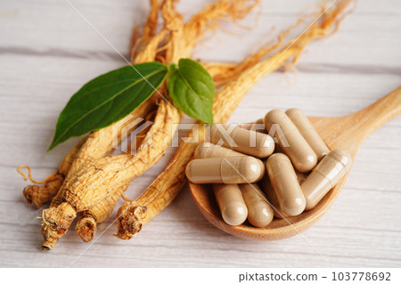 Ginseng roots and green leaf, healthy food. 103778692