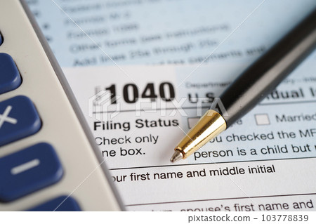 Tax form 1040 U.S. Individual Income Tax Return, business finance concept. Tax form 1040 U.S. Individual Income Tax Return, business finance concept. 103778839