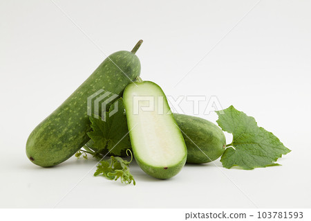 Against a white background, fresh winter melon and green leaf isolated. Winter melon contains a high amount of vegetable oil, which is very beneficial for skin and hair 103781593