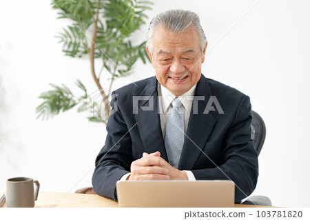 A man thinking while looking at a computer Business 103781820