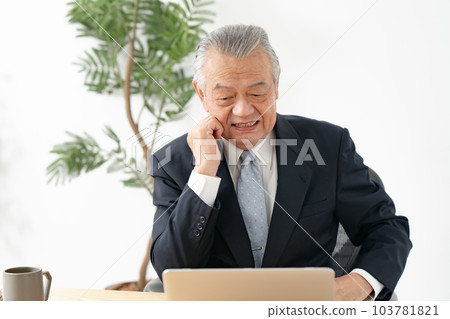 A man thinking while looking at a computer Business 103781821