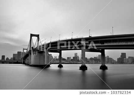 Monochrome evening view of Rainbow Bridge seen from Daiba Park Long-second exposure 103782334