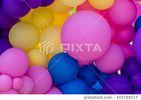 Bright abstract background of jumble of rainbow colored balloons, celebrating Bright abstract background of jumble of rainbow colored balloons, celebrating 103789517