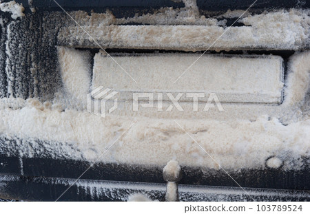 snow and mud covered car license plate. snow and mud covered the car license plate. Vehicle registration plate is not read 103789524