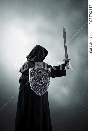 Dark knight with sword and shield over dark misty background Dark knight with sword and shield over dark misty background 103790312