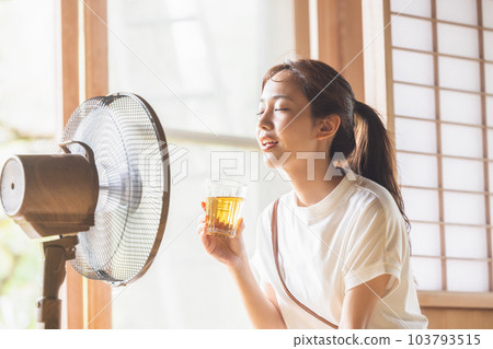 Woman drinking barley tea 103793515