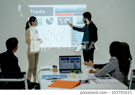 Business man and woman help and support to present the project together in front of meeting room  103793815