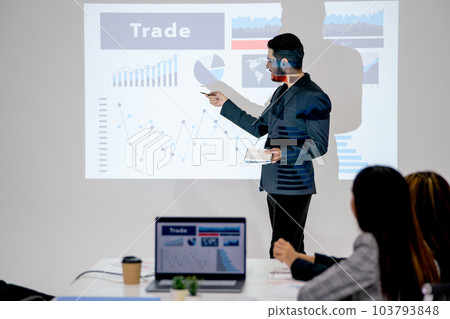 Business man look like lbgt style present about the project in meeting room and coworkers Business man look like lbgt style present about the project in meeting room and coworkers 103793848