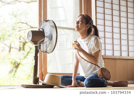 Woman drinking barley tea Woman drinking barley tea 103794334