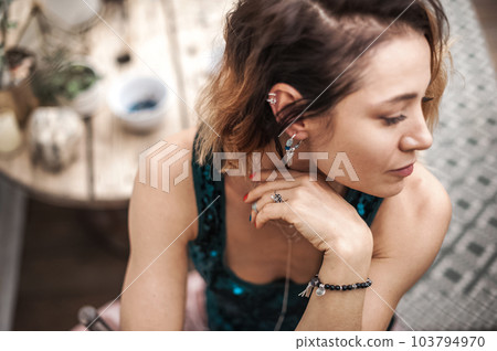 Attractive woman sitting pensively and lonely close up and copy space. Selective focus Attractive woman sitting pensively and lonely close up and copy space. Selective focus 103794970