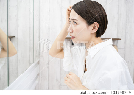 Beauty image of a young woman doing hair care Beauty image of a young woman doing hair care 103798769