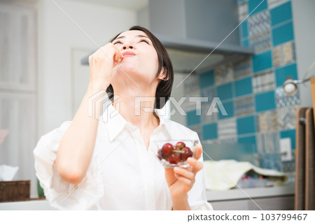 Young woman eating cherries Eating and drinking image 103799467