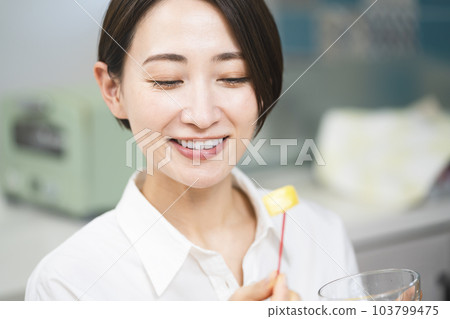 Young woman eating pineapple Food and drink image 103799475