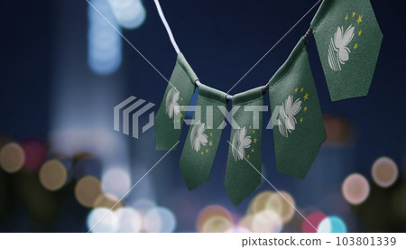 A garland of Macao national flags on an abstract blurred background A garland of Macao national flags on an abstract blurred background 103801339