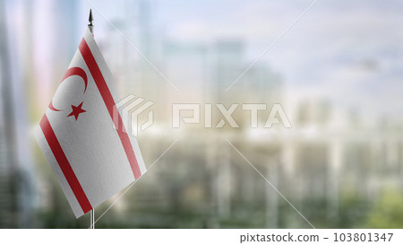 A small Northern Cyprus flag on an abstract blurry background 103801347