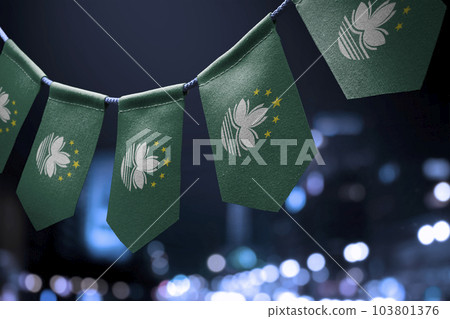 A garland of Macao national flags on an abstract blurred background 103801376