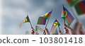 A group of people holding small flags of the New Caledonia in their hands 103801418