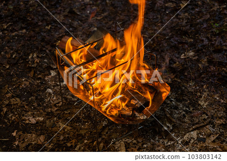 Bonfire enjoyed in the corner 103803142