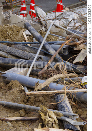 House demolition site Reinforced concrete Demolition of concrete walls and foundations Mountain of rubble 103803202