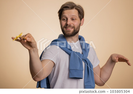 Magician wizard man gesturing with magic wand making wish come true, casting magician spell Magician wizard man gesturing with magic wand making wish come true, casting magician spell 103805304