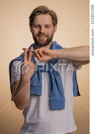 Man showing hashtag symbol with hands, likes tagged message, popular viral social media content Man showing hashtag symbol with hands, likes tagged message, popular viral social media content 103805306