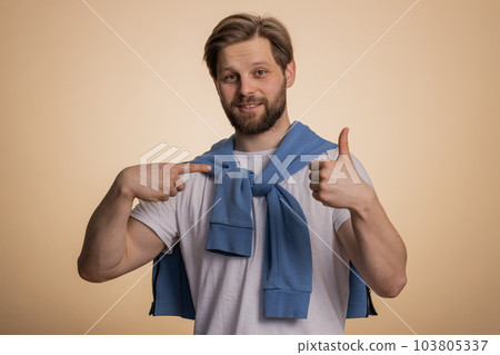 Excited caucasian young winner man feeling very proud pointing hisself, overjoyed by success victory 103805337