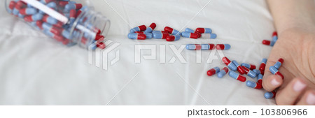 Closeup of woman hand and tablet on bed 103806966