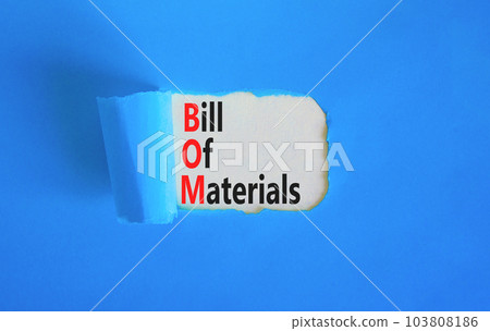 BOM bill of materials symbol. Concept words BOM bill of materials on beautiful white paper. Beautiful blue table blue background. Business and BOM bill of materials concept. Copy space. 103808186