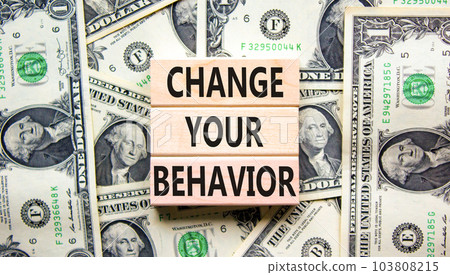 Motivation and Change your behavior symbol. Concept words Change your behavior on wooden block on a beautiful background from dollar bills. Business change your behavior concept. Copy space. Motivation and Change your behavior symbol. Concept words Change your behavior on wooden block on a beautiful background from dollar bills. Business change your behavior concept. Copy space. 103808215