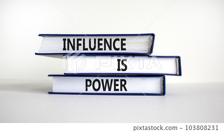 Influence is power symbol. Books with words 'Influence is power'. Beautiful white background. Business, influence is power concept, copy space. 103808231