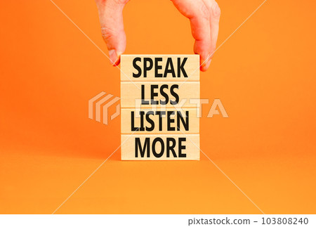 Speak less listen more symbol. Concept words Speak less listen more on wooden block. Beautiful orange table orange background. Motivational business speak less listen more concept. Copy space. Speak less listen more symbol. Concept words Speak less listen more on wooden block. Beautiful orange table orange background. Motivational business speak less listen more concept. Copy space. 103808240