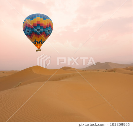 Desert and hot air balloon Landscape at Sunrise. Travel, inspiration, success, dream, flight concept Desert and hot air balloon Landscape at Sunrise. Travel, inspiration, success, dream, flight concept 103809965