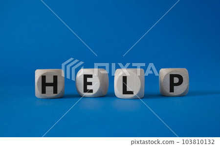 Help symbol. Concept word help on wooden cubes. Beautiful blue background. Business and help concept. Copy space. Help symbol. Concept word help on wooden cubes. Beautiful blue background. Business and help concept. Copy space. 103810132