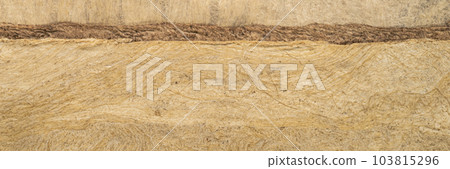 abstract landscape - background of buckskin amate bark paper handmade created in Mexico, panorama banner abstract landscape - background of buckskin amate bark paper handmade created in Mexico, panorama banner 103815296