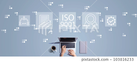 ISO 9001 concept with person working with laptop 103816233