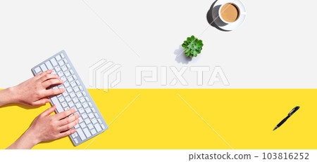 Woman using a computer keyboard 103816252