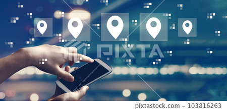 Map pin concept with person using smartphone Map pin concept with person using smartphone 103816263