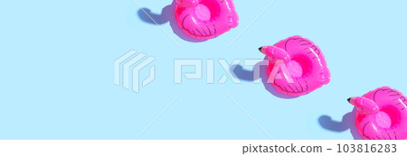 Summer concept with pink flamingo floats Summer concept with pink flamingo floats 103816283