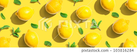 Fresh yellow lemons with mints overhead view Fresh yellow lemons with mints overhead view 103816284