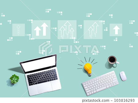 Rising arrow theme with computers with a light bulb 103816293