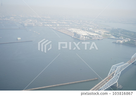 Taken from inside an airplane | Cityscape of a hazy big city | Air pollution image | Pollution image | Tokyo Taken from inside an airplane | Cityscape of a hazy big city | Air pollution image | Pollution image | Tokyo 103816867